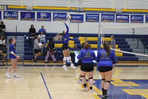 Photo by Christopher Smith/Staff Ava Schmitt goes up for a kill against Nantahala. 