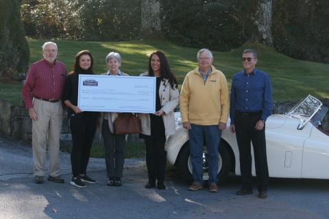 Photo by Ryan Hanchett/Staff Steve Mehder, Cindy Trevathan, Linda Edwards, Bonnie Potts, Mark Chmar and Knight Martorell presenting the check to the Literacy Council of Highlands, REACH of Macon County and the Community Care Clinic. 