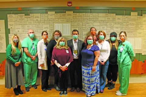 Photo by Christopher Smith/Staff Highlands-Cashiers Hospital staff surprised CEO Tom Neal with the NCHA Healthcare Hero Award last Friday. 