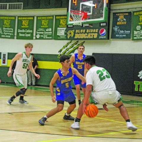 Photo by Michael O’Hearn/Staff Highlands’ Jeffrey Olvera defends against Blue Ridge on Dec. 14. The Highlanders won the game 63-35.