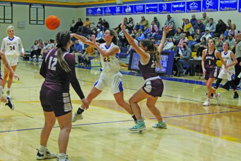 Photo by Christopher Lugo/Staff Ava Schmitt passes the ball. 