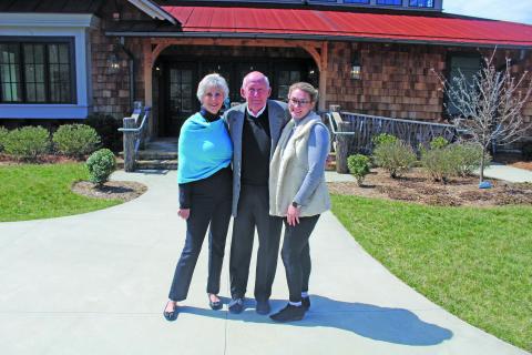 Photo by Michael O’Hearn/Crossroads Chronicle Village Green executive director Ashlie Mitchell-Lanning with Bill and Sue Lewis. 
