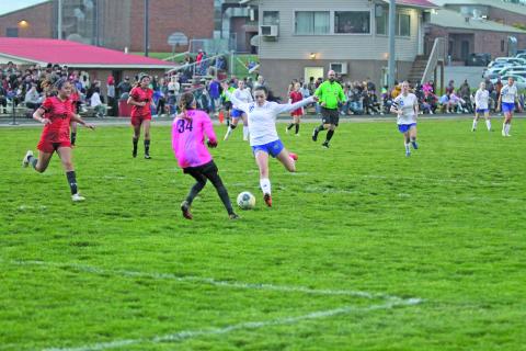 Photo by Christopher Lugo/Staff Highlands senior Reese Schmitt leans back for a shot against Franklin Friday night. Schmitt had two goals on the night. 
