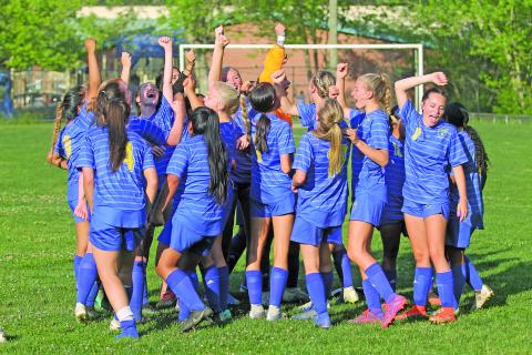 Photo by Christopher Lugo/Staff The Lady Highlanders break it down after their historic win against Elkin, Thursday night. 