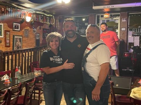 Brent Holbrooks (center) celebrated with family and friends at Rathskeller on Tuesday night as election results showed him the winner in the race for Macon County Sheriff. He is pictured with his sister April Chastain and brother Eric Duvall. Photo by Mia Overton/The Franklin Press