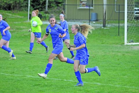 Photo by Christopher Lugo/Staff HHS seniors Julia Schmitt and Hayley Borino both had two goals on the night. 