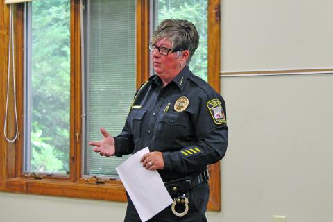 Photo by Christopher Lugo/Staff Highlands Police Chief Andrea Holland spoke during  the Community Coffee at Hudson Library last Friday. 