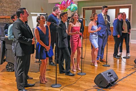 Photo by Ryan Karcher Photography The full cast sings the finale song, “Heart Behind These Hands” from Brooklyn: The Musical at Mountain Theatre Company’s Spotlight Benefit Event. 