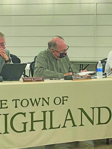 Photo by Christopher Lugo/Staff Commissioner Marc Hehn combs through the two UDO draft options.