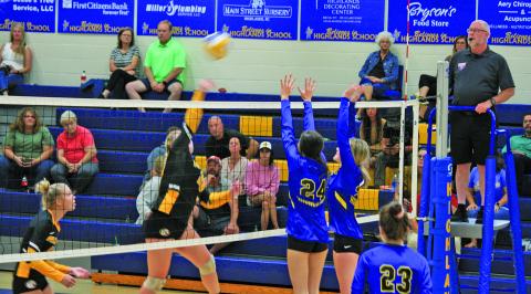 Lady Highlanders Ezra Branham (24) and Ashlynn Wilson (21) go up for a block against Murphy on Thursday night.
