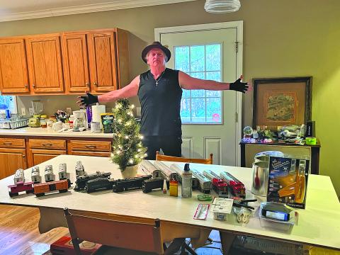 Ralph Hicks shows off the three fully restored trains that will be taken to new homes during the 16th annual Scooter’s Train Giveaway.
