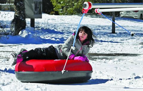 The snow tube merry-go-round will be back in action when Snow Fest at 4118 takes over Kelsey-Hutchinson Founders Park this weekend.
