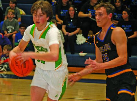 Highlands’ James Earp defends Blue Ridge forward Ethan Henson during their game on Friday night.