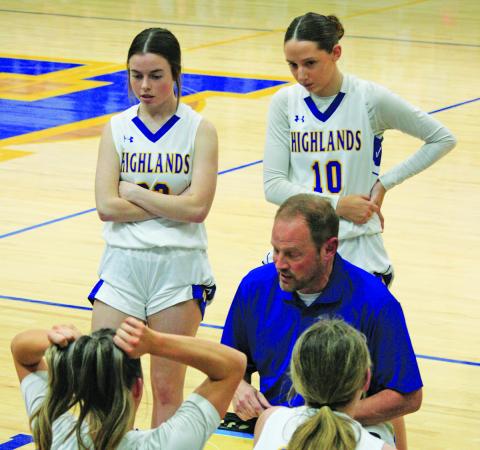 Highlands head coach Brett Lamb draws up a play during a playoff game against Hiwassee Dam.