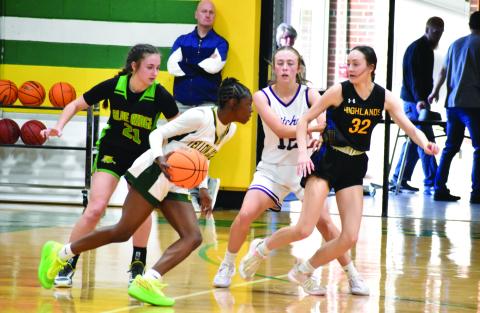 Highlands’ Ezra Branham (32) and Blue Ridge’s Mahala Stewart (21) defend during the 1-A West/Midwest All-Star game in Bessemer City.