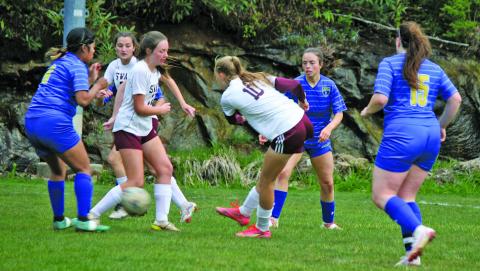 Highlands defenders smother Swain County forwards during their game on Friday night. Highlands won the game 4-1.