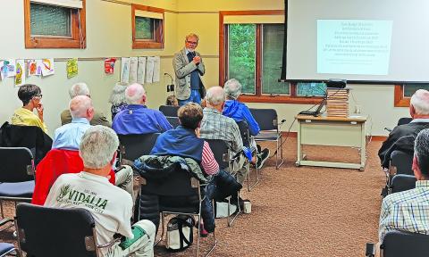 Highlands Mayor Pat Taylor discusses the recent property revaluation in Macon County during his “Coffee with the Mayor” program.