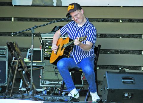 Lamont Landers plays during Porchfest at Kelsey-Hutchinson Founders Park.