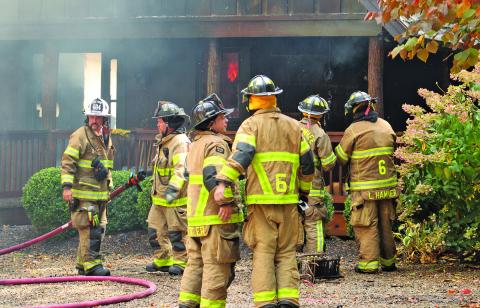 Firefighters from Cashiers-Glenville, Highlands, Cullowhee and Lake Toxaway battled a fire on Trillium Ridge on Oct. 10. The fire most likely started in the chimney, according to CGFD Chief Randy Dillard.