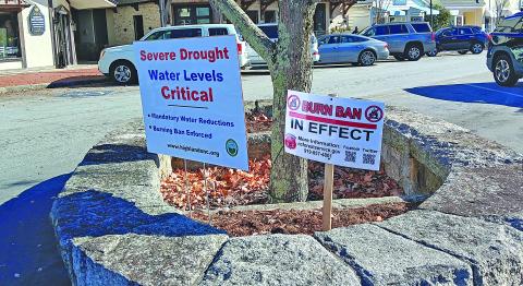 The Town of Highlands has posted signs along Main Street letting people know about water restrictions and the ongoing burning ban.