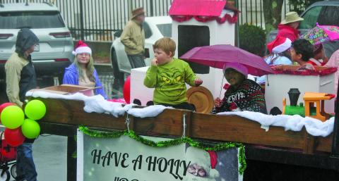 Photo by Ryan Hanchett/Staff Students from The Literacy and Learning Center in Highlands manned a reading themed float for the Olde Mountain Christmas Parade on Saturday in support of Dolly Parton’s Imagination Library.
