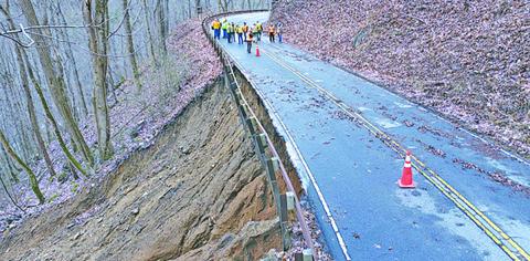NC Department of Transportation crews assess 80-feet of washed out shoulder along US 64 in the Cullasaja Gorge.
