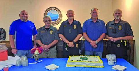 Sky Valley Police Chief Vaughn Estes (center) announced his resignation at the end of July after more than seven years in his current position.