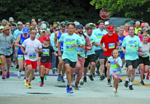 The start of the annual Rotary Club of Highlands Twilight 5k was as busy as ever, despite lingering rain showers on Saturday evening.