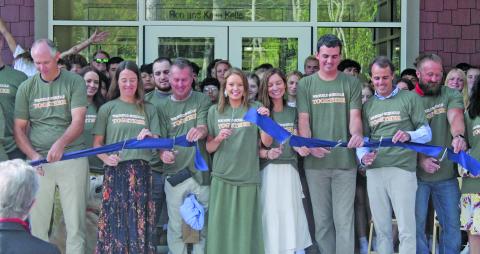 Representatives from Summit Charter School gathered to cut the ribbon on the new high school building on Friday.
