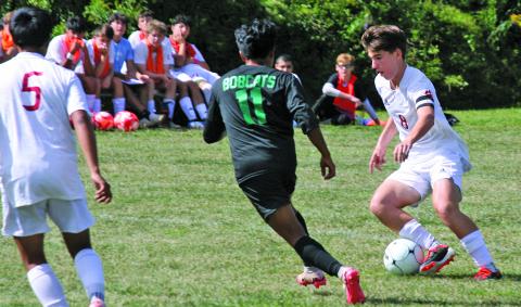 Blue Ridge’s Miguel Juan-Julian (11) defends as Franklin’s Graham Caldwell looks to find a shooting lane during their game on Thursday.