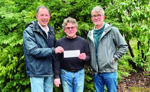 David Bock and Jack Austin with Highlands Festivals Inc. presented a check for $10,000 to Friends of Founders Park President Hank Ross on Monday.