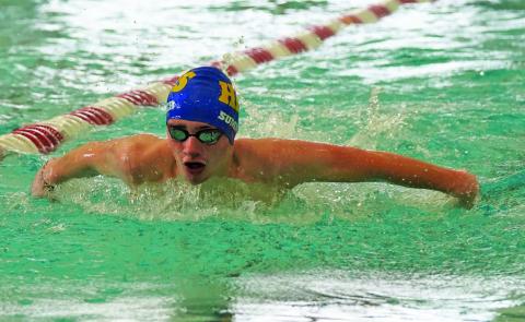 Highlands’ Jack Sumner swims the 100 butterfly during the Candy Cane Invitational in Murphy.