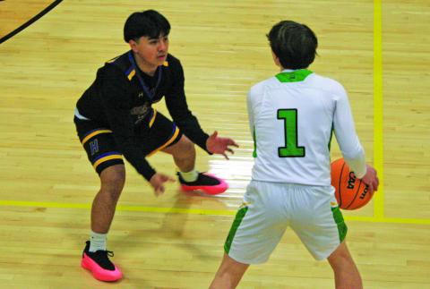 Highlands’ Brian Jarquin defends Blue Ridge’s Dakota Kinsey (1) during their game on Tuesday night.