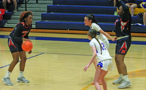 Highlands Jordyn Borino (12) and Aislynn Wyatt-Luck (2) defend the lane against CPLA’s Melody Johnson (4) and Shanya McRae (30).