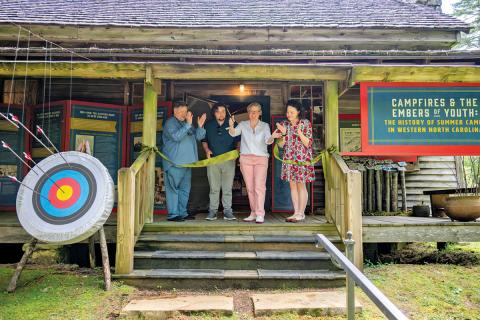 Cutting the ribbon to open the new exhibits are Charles Gandy, Jason Steinfeld, Lindsay Garner Hostetler, and Amelia Golcheski.