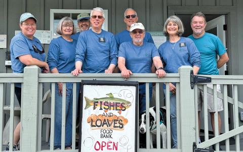 Peter Hall, Stanley Odum, Bonnie Grossman, Lynne Griffon, Larry Morris, Phillip Jackson, Betty Morris and Bill Fehrs help carry the mission of Fishes and Loaves.