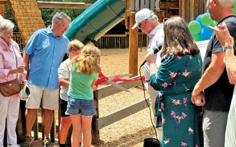 A ribbon cutting ceremony officially opened Village Play.