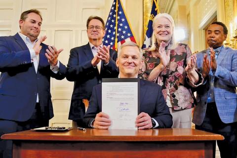 Sen. Kevin Corbin sponsored Senate Bill 124 and joined Gov. Josh Stein as he signed the bill into law.