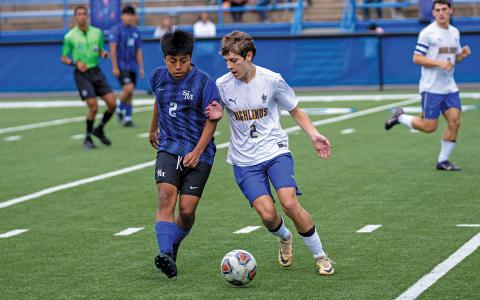 Photo courtesy of Todd Sumner  |  Stephen Pierson (right) moves the ball past a Smoky Mountain High opponent in Monday’s game.