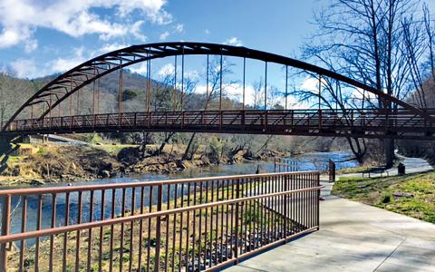 A greenway flanks the Tuckasegee River.