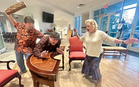 Cast members Todd Lipphardt, Craig Eister and Bet Hunter rehearse a scene from Deathtrap.