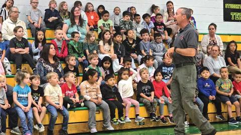 Photo by Bill Davis - Students at Blue Ridge School listen as Captain Brandon Green, president of Jackson County Fire & Life Safety,  and a firefighter with the Savannah Fire Department, talks about fire safety.