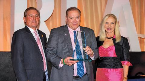 2025 Chairman of the Board Nick Sarra and President & CEO Carol Dover present the FRLA Restaurateur of the Year award to Mike Quillen.