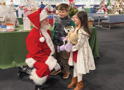 Nora Kate and Everett McLure meet with Santa at the Cashiers Festival of Trees over Thanksgiving weekend  |  Photo courtesy of Summit Charter School