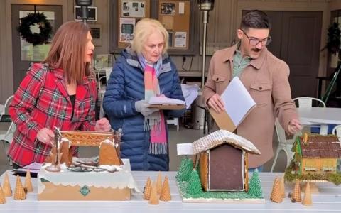 From left: Judges Joanne Bryson, Ann McKee Austin and Clark Haywood discuss the gingerbread competition entries at Cashiers Historical Society Dowden Pavilion on Dec.4.  |  Photo courtesy of Cashiers Historical Society)