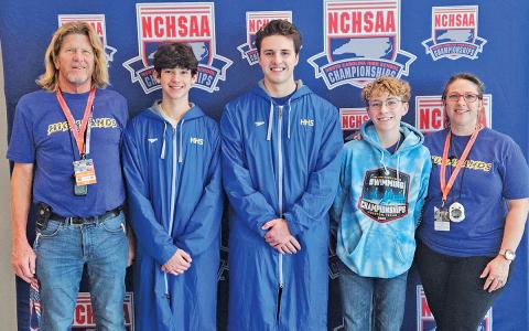 (From left to right) Head Coach Steve Hott, Ian Batista, Aniah McKim, Team Manager Justin Powell and Assistant Coach Jackie Powell attended the NCHSAA Swimming State Championships on Saturday, Feb. 14.  |  Photo courtesy of Jackie Powell