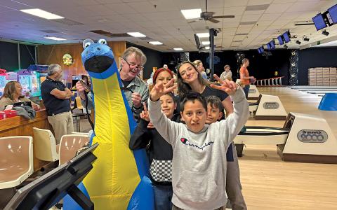 Several “Littles” enjoy a night of bowling with Clarissa Emily and other “Bigs” at the BBBS Bowl For Kid’s Sake fundraiser.  |  Photo by Danielle Hernandez