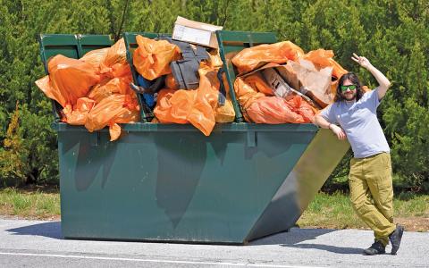 Mick Mayer poses with a full dumpster following the conclusion of the 2025 Plateau Pickup.  |  Photo courtesy of Highlands Chamber