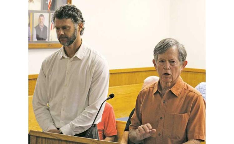 Press photo/Shelby Powell - Philip Curcuru (left) and Andrew Chmar of the Hudson Library Foundation outline a request for renovations at the Hudson Library.