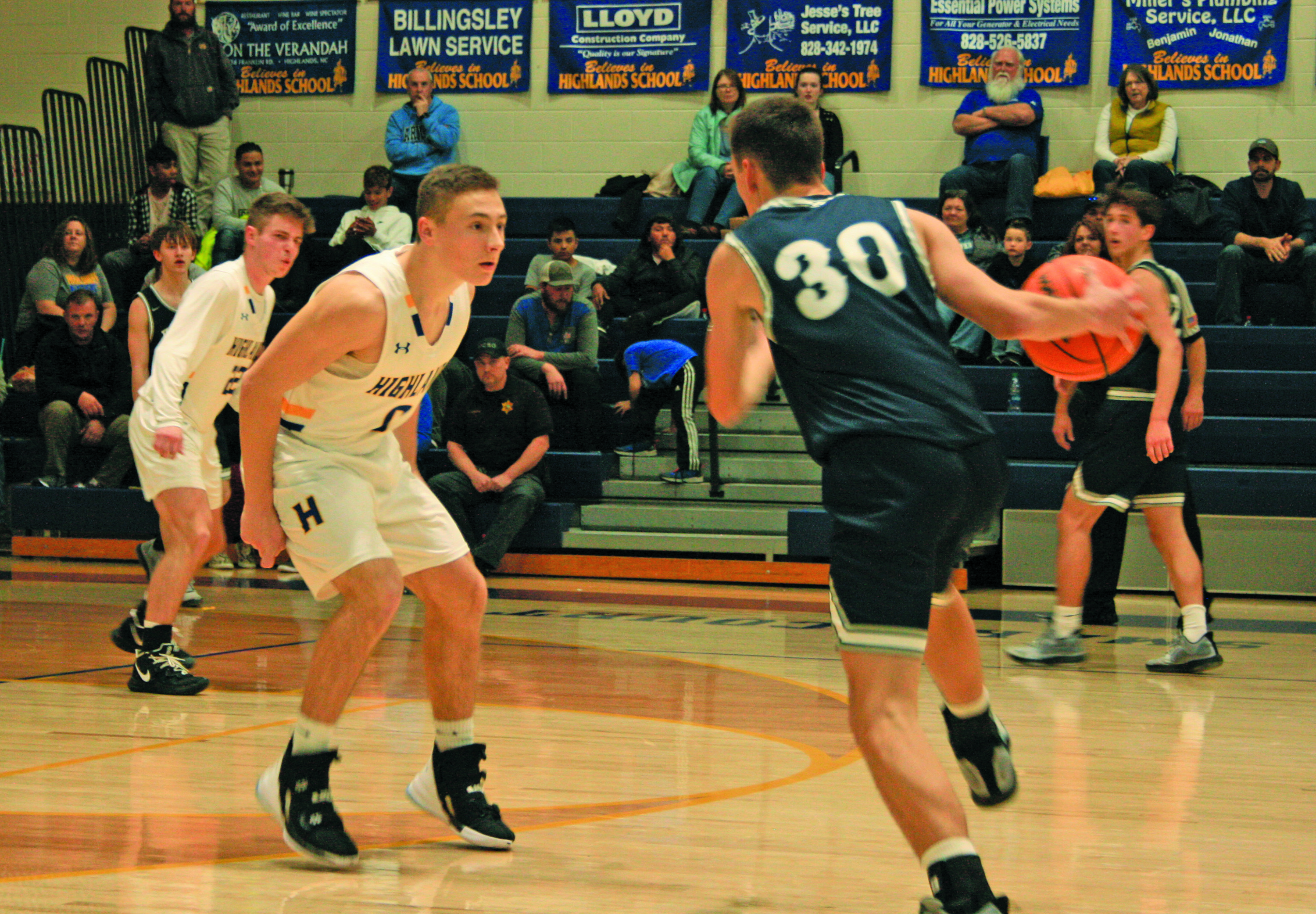 Connor Briggs (0) does his best to stay in front of Nantahala forward Dylan Stroud.